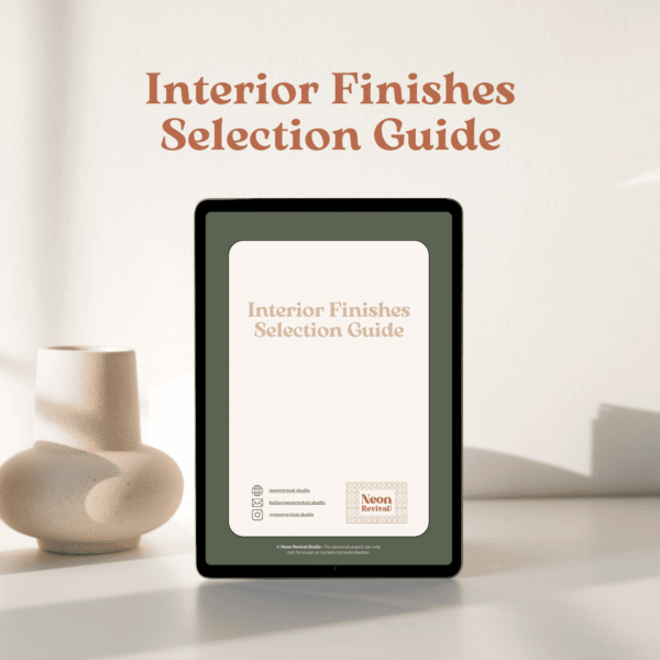 interior finishes selection guide_1 Tablet mockup displaying the cover of the Interior Finishes Selection Guide by Neon Revival Studio, styled with soft shadows and ceramic décor
